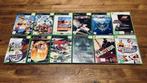 12 game titles arranged on a wooden table